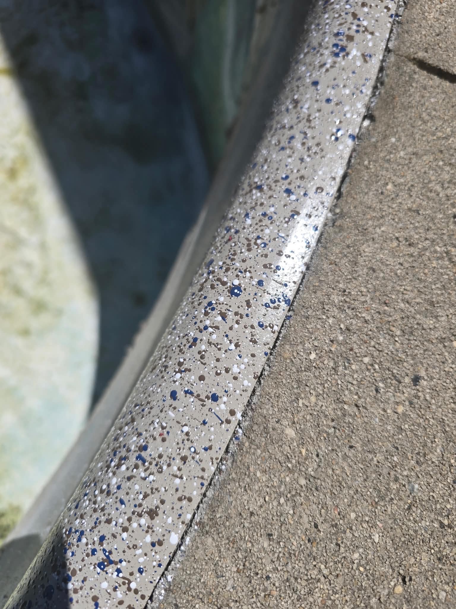 Blue speckled pool coping edge