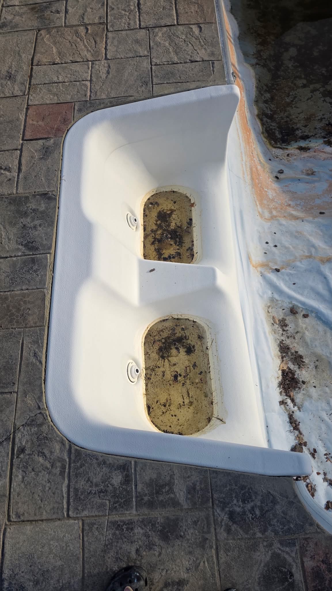 Dirty and worn fiberglass buddy seat before resurfacing