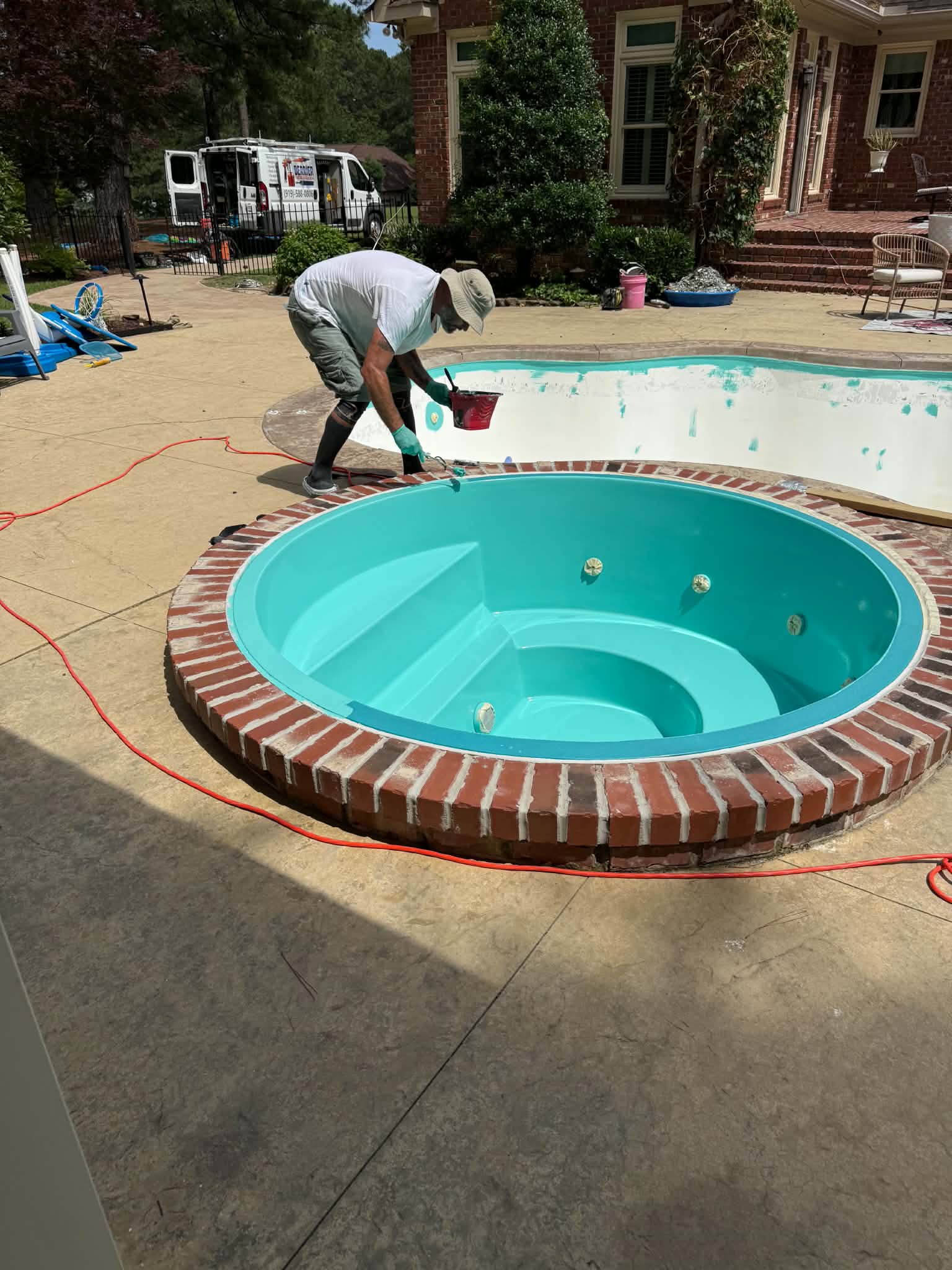 Technician working inside a circular spa