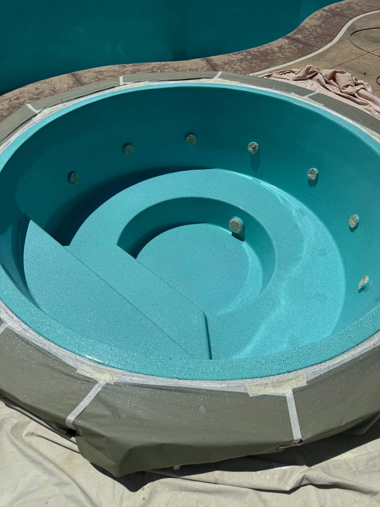 Aquagreen circular spa basin after resurfacing