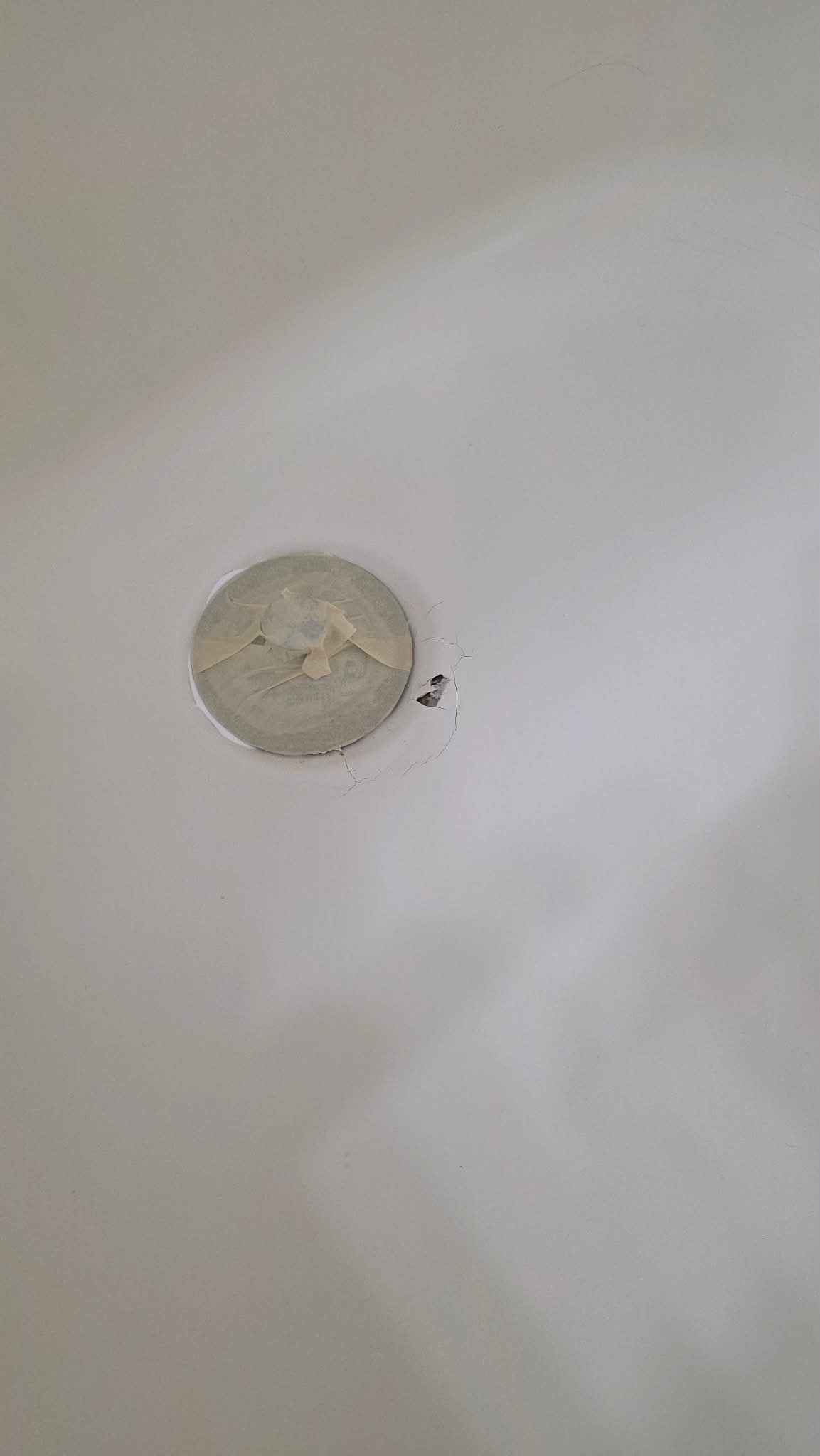 Bathtub drain area before refinishing
