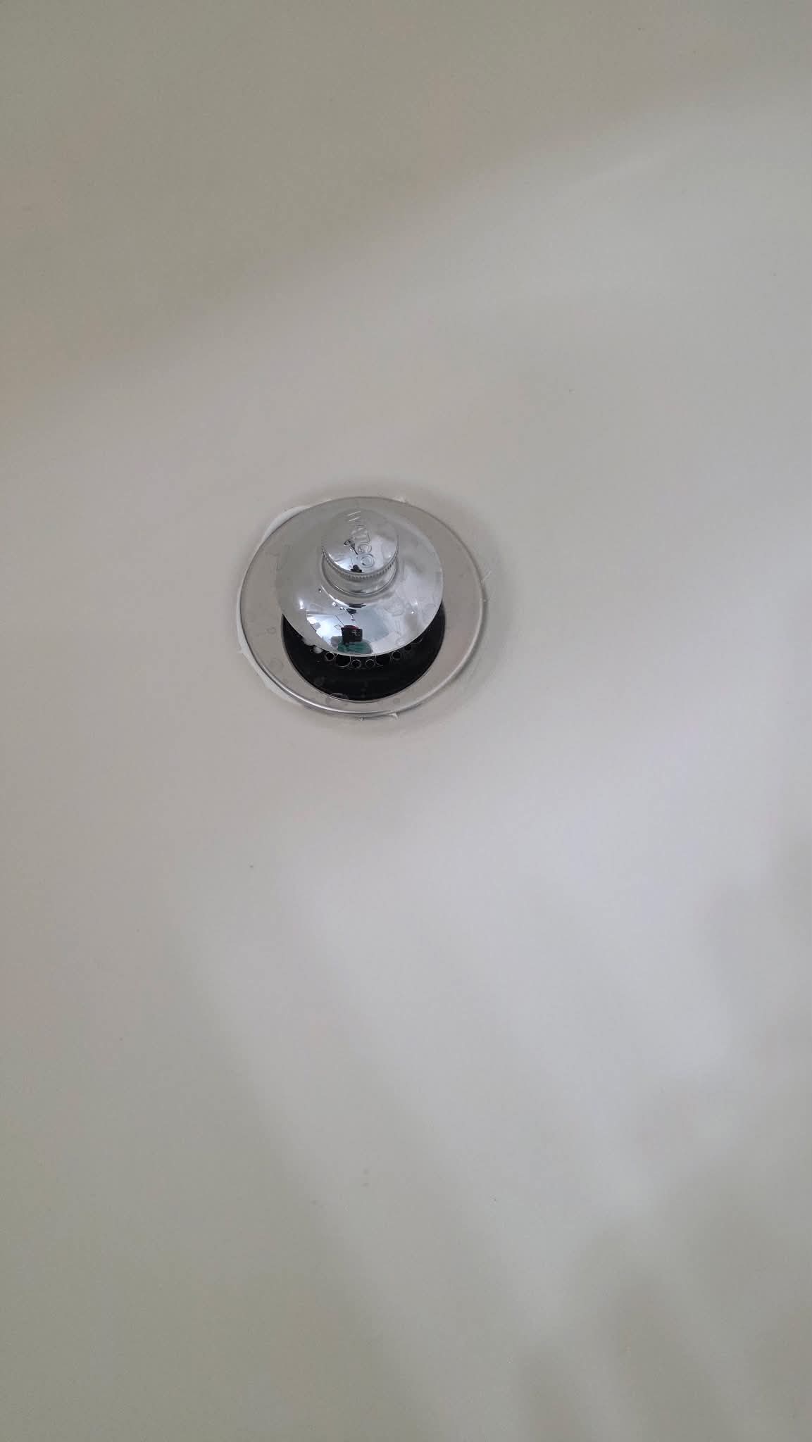 Bathtub drain area after refinishing