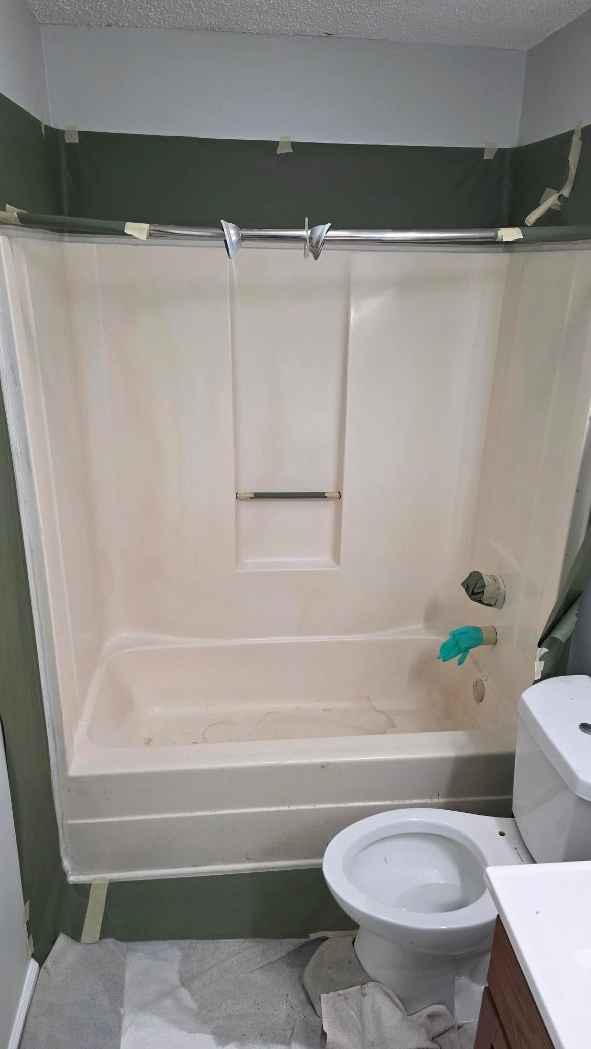 Tub and shower surround masked before refinishing