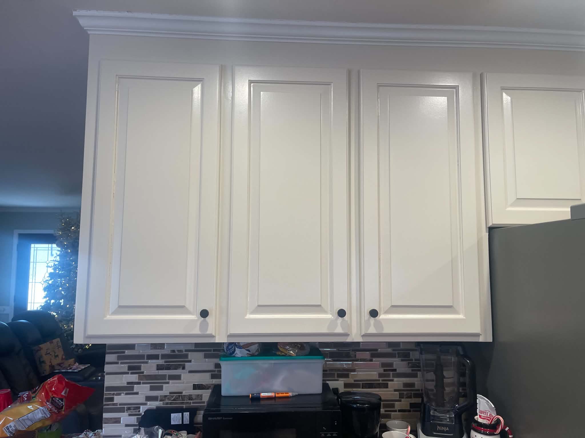 Finished white upper kitchen cabinets