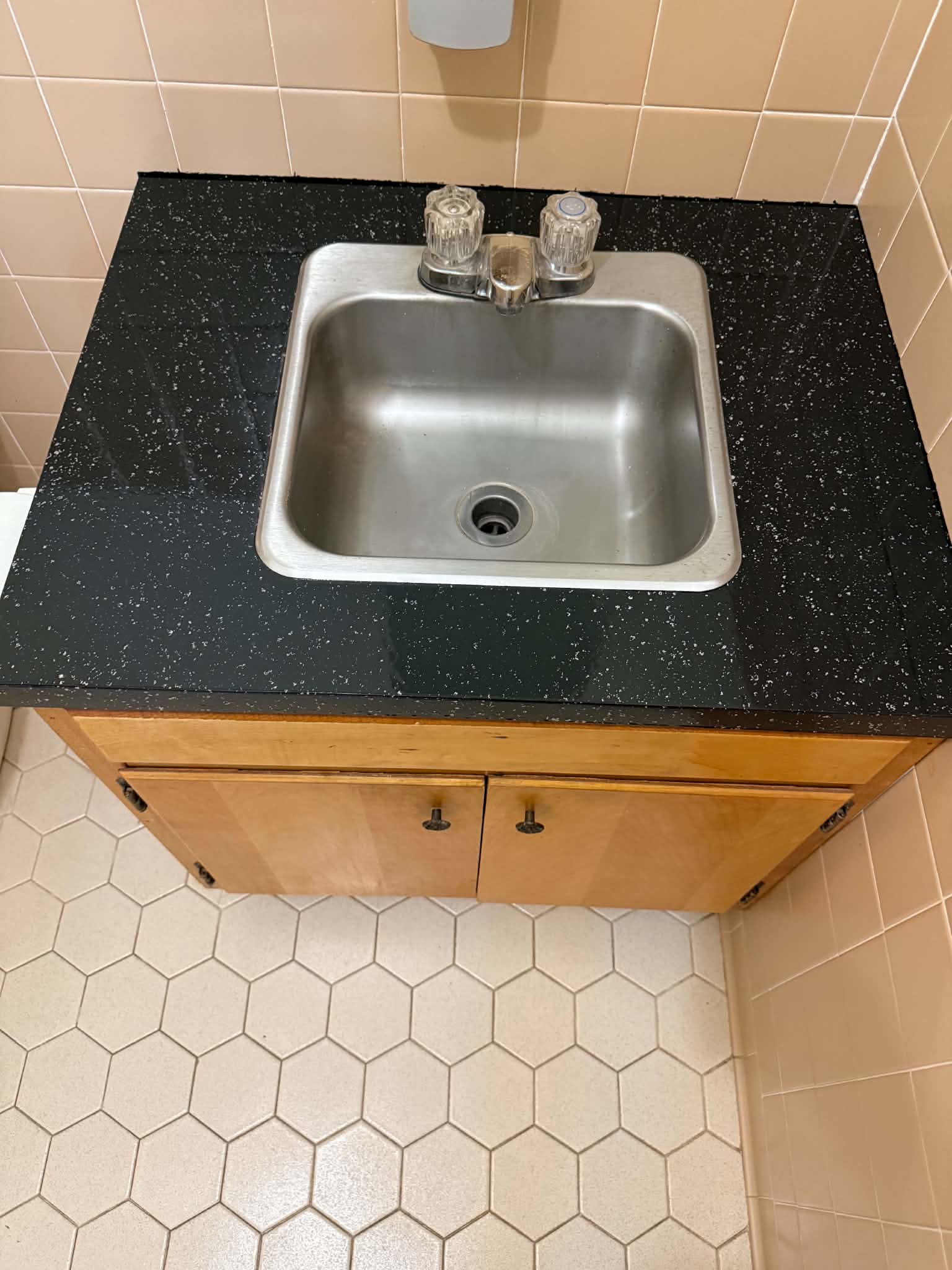 Black speckled vanity top after resurfacing