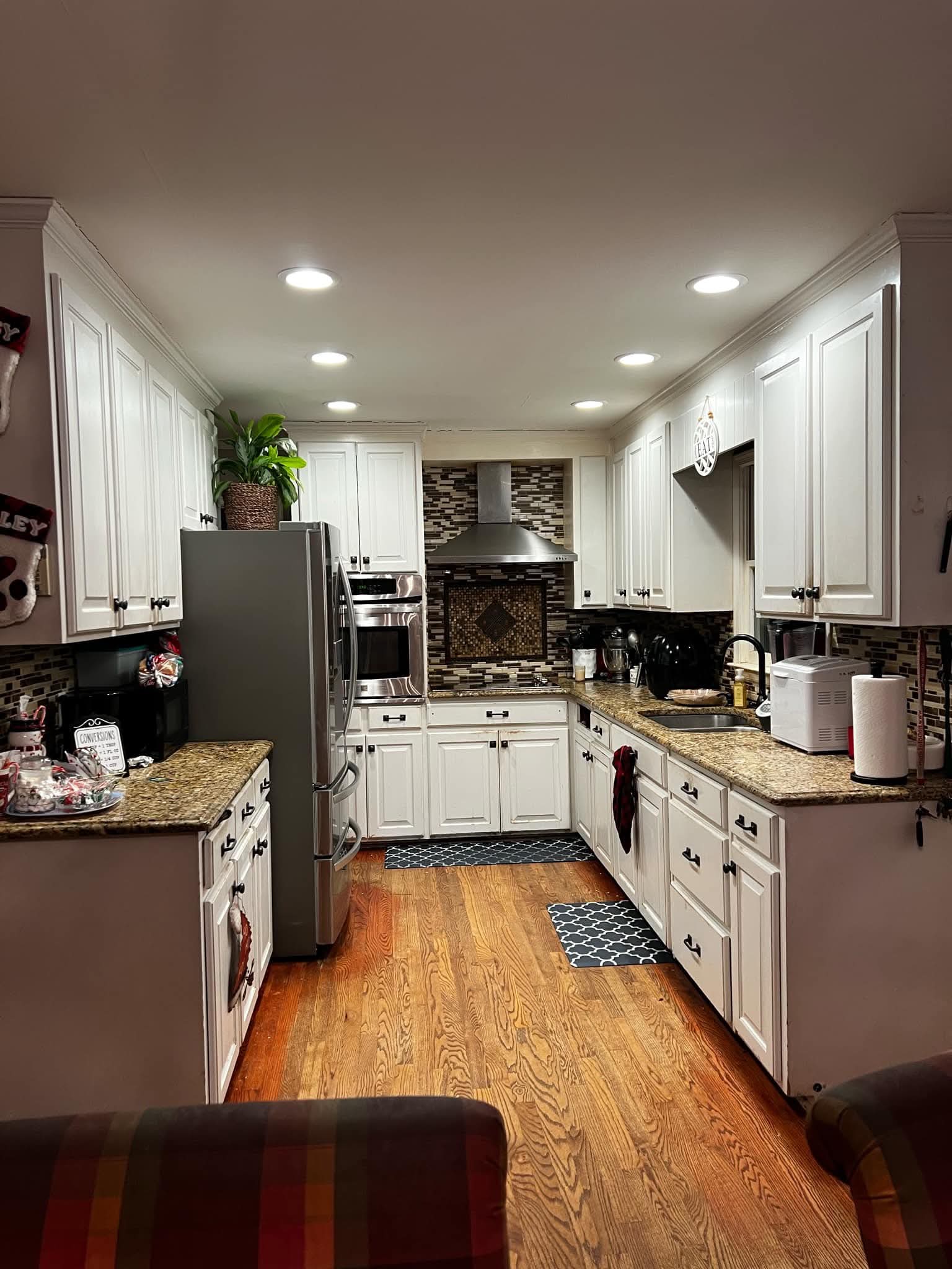 Finished white kitchen cabinets in a full-room view