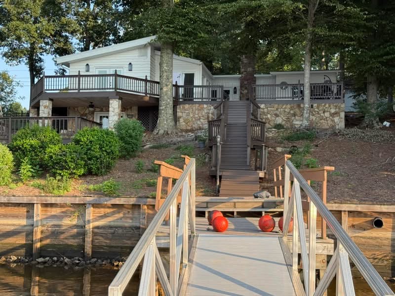 The painted lakefront exterior viewed from the dock
