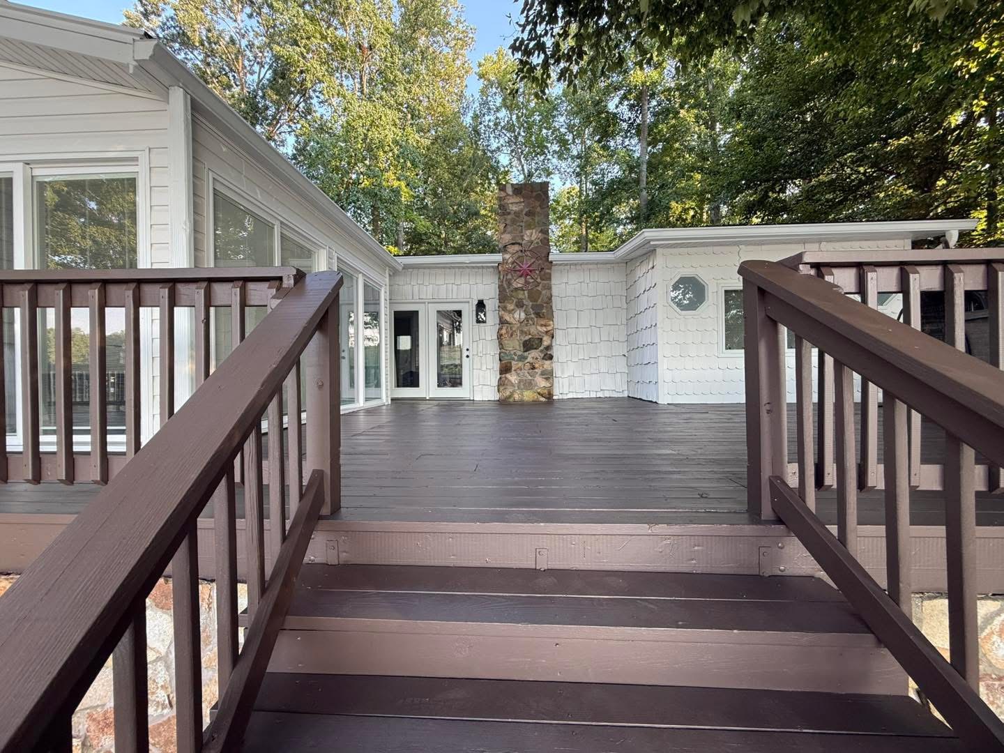 Deck and stone chimney area after exterior painting