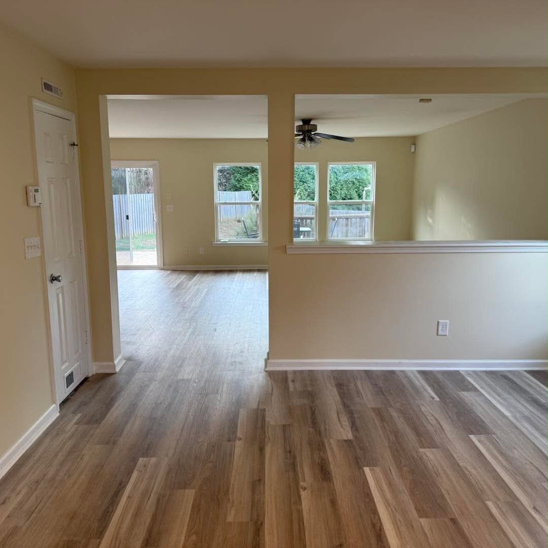 Cream interior walls and white trim around an open living area