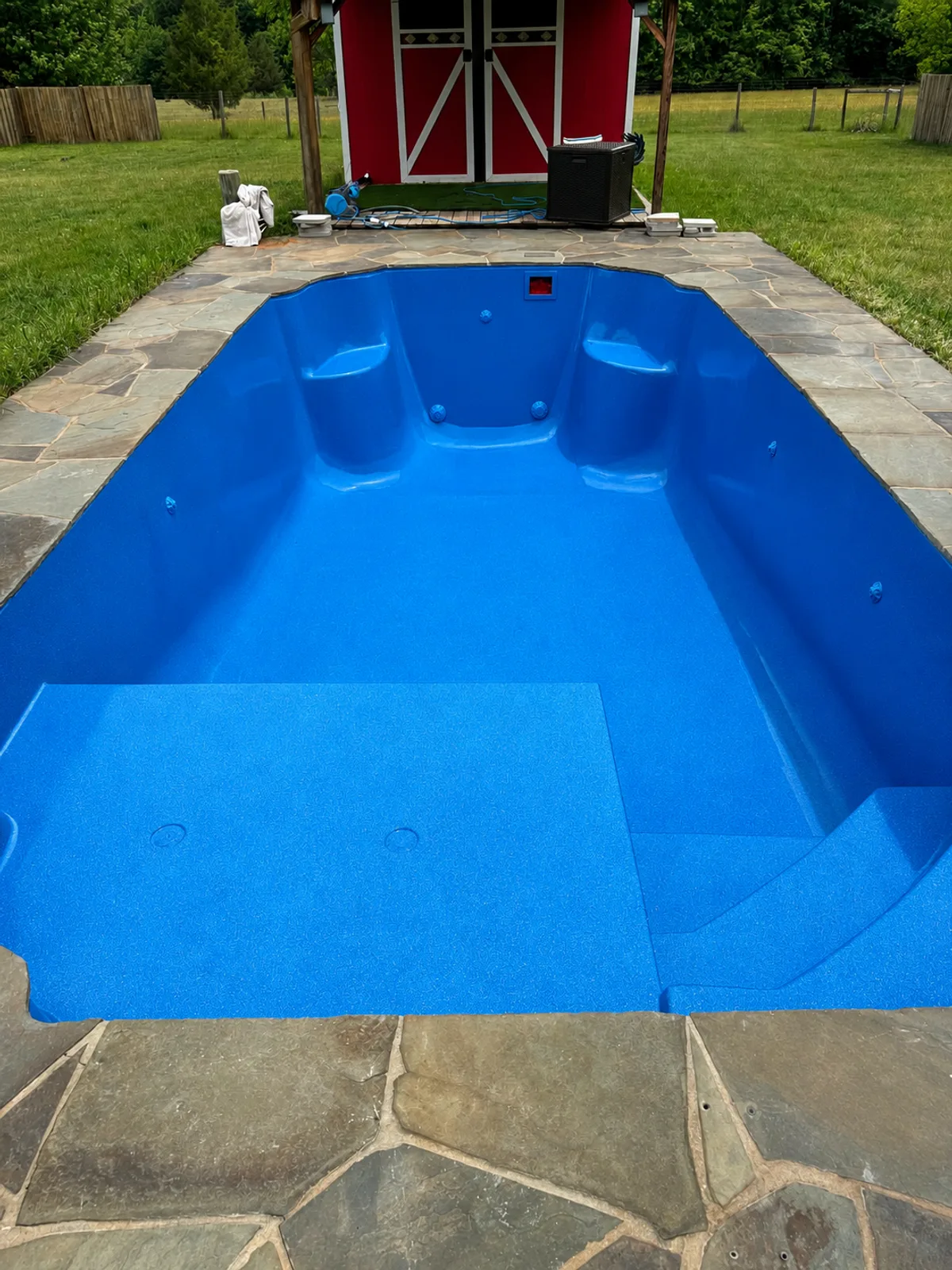 Fiberglass pool resurfacing — Royal Blue finish